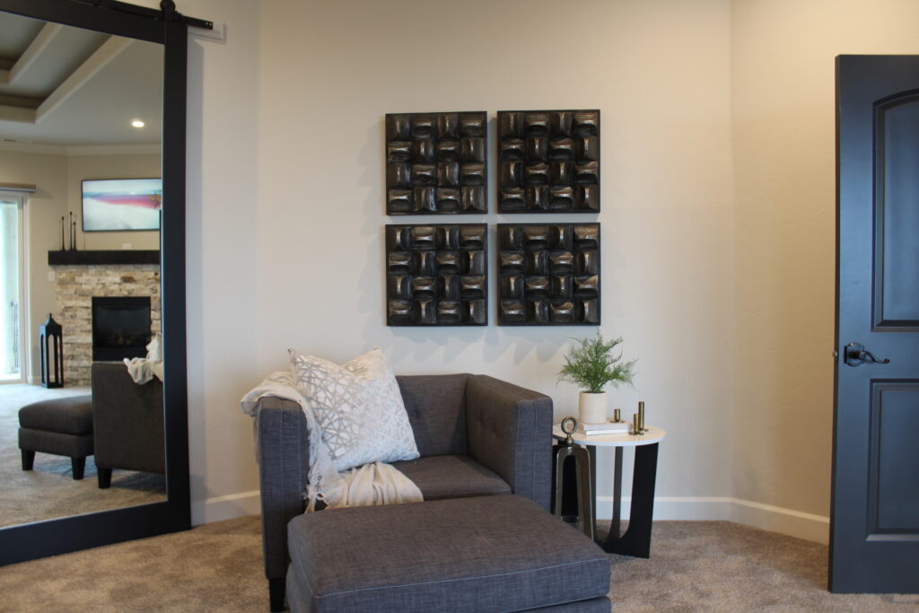 Primary Suite Bedroom with Mirror and sitting area styling 
